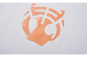 Close-up of the detailed orange tiger head print on white cotton long-sleeve tee