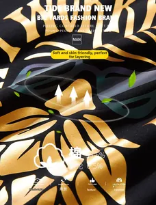 Detail of black cotton T-shirt featuring gold metallic lettering and high-quality texture