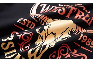 Macro detail of the vintage bull skull print and WESTRE typography on black cotton fabric