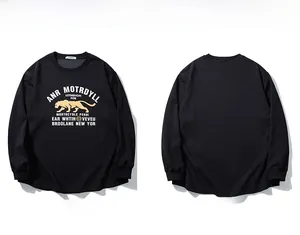 Detail of black long-sleeved shirt with yellow puma and vintage letter print