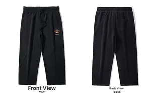 Front and back detail of black drawstring joggers with orange graphic and side pockets
