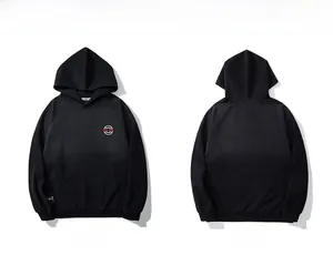 Front and back view of a black oversized hoodie featuring a small red chest logo and UT tag