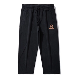 Pantalon de jogging noir avec taille élastique à cordon et broderie orange vintage