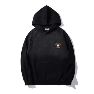 Heavyweight black cotton hoodie with embroidered orange monkey logo and raglan sleeves