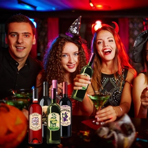 Group of friends holding wine bottles with spooky retro Halloween label stickers at a party