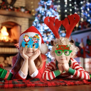 Christmas party paper glasses featuring Santa and Merry Christmas text for kids decor