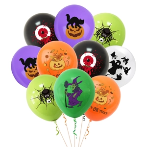 Detail of Halloween balloons with witch, ghost, and spider web prints for party decor