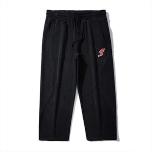 Men's black street-style sweatpants with embroidered logo and drawstring waist