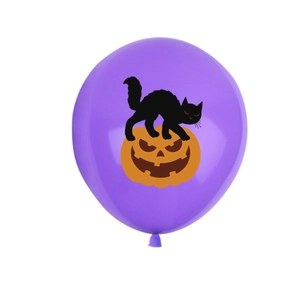 Macro shot of purple Halloween balloon featuring black cat on pumpkin for party decor