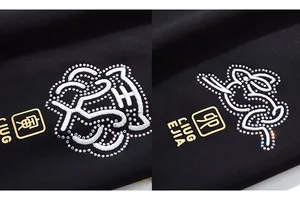 Détail de la broderie zodiaque avec strass sur un pantalon de jogging noir