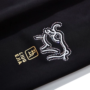 Pantalon de sport noir pour homme avec broderie zodiaque bœuf et détails dorés brillants