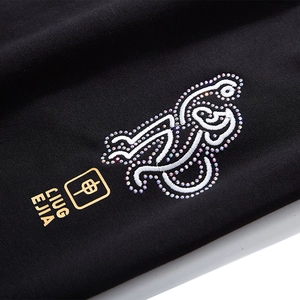 Pantalon de jogging noir pour homme avec broderie zodiacale, strass et détails en feuille d'or