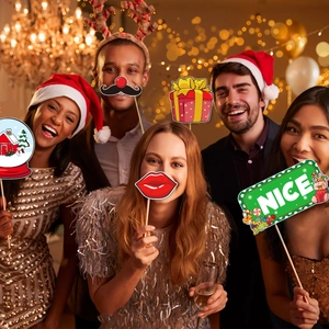 Christmas photo booth props set with Santa hats and reindeer horns for party fun