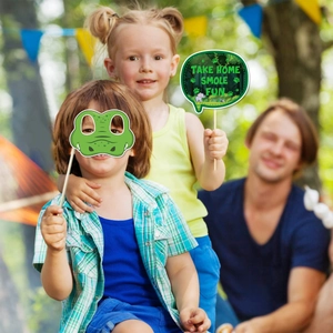 Kids wearing jungle party props with crocodile mask and elephant handheld photo signs