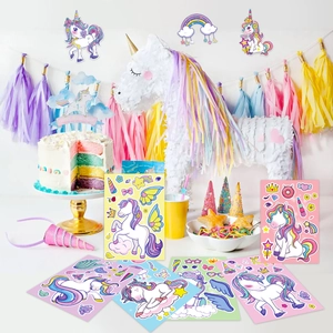 Close-up of unicorn party DIY stickers with rainbow fringes and colorful cake toppers