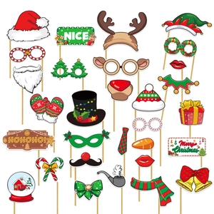 Christmas party photo booth props with Santa hats and snowmen decorations on sticks