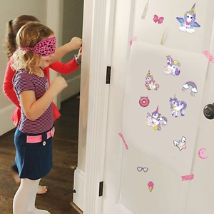 Unicorn birthday party game set with kids using stickers and pink leopard blindfold