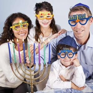 Hanukkah party paper glasses with Love and Light text and festive Jewish holiday designs