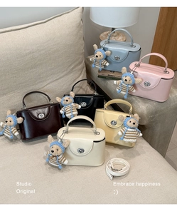 Detailed collection of small crossbody bags in six colors with teddy bear charms