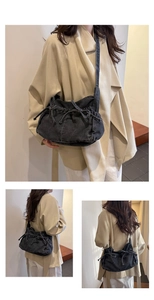 Detail shots of black denim bucket bag with drawstring bow and adjustable shoulder strap