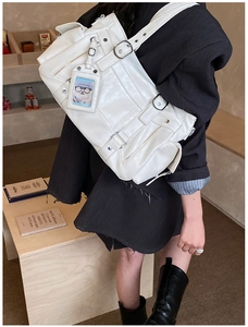 Detailed view of white multi-pocket cyber-Y2K tote bag with metal buckles and clear ID slot