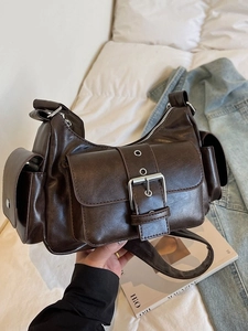 Vintage dark brown multi-pocket motorcycle bag with silver metal buckles and shoulder strap