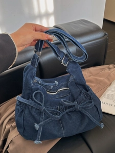 Vintage dark blue denim bucket bag with double bows and adjustable shoulder strap