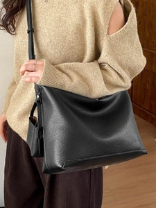 Retro soft leather tote bag for women featuring a large capacity and minimalist black design