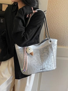 Large silver metallic tote bag with charm pendant for commute and casual wear