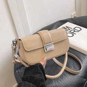 Beige faux leather crossbody bag with silver buckle and metal chain strap decoration