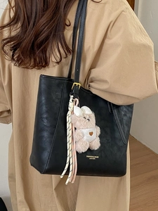 Large black crackle texture tote bag for women with gold buckles and plush bear charm