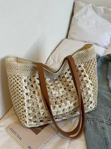 Straw woven tote bag with checkered pattern and brown faux leather handles for summer