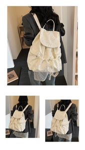 Detail view of beige casual backpack with star pattern and drawstring closure on model