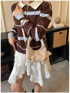 Chic hobo bag with floral embroidery and ruched cloud handle in casual setting