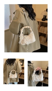 Detail of off-white crescent bag with lace bow, pearl chain and pleated cloud handle