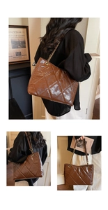 Detail of glossy dark brown quilted tote bag with golden chain and large capacity