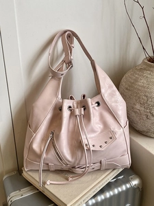 Vintage light pink leather tote bag with punk drawstring and silver rivet details