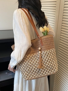 Bohemian hollow woven straw tote bag with dual-tone texture and brown leather straps