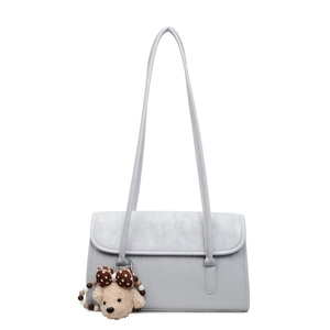 Minimalist light blue PU leather shoulder bag with a cute plush bear charm for women