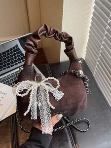 Vintage brown textured handbag with lace bow and elegant chain strap for women