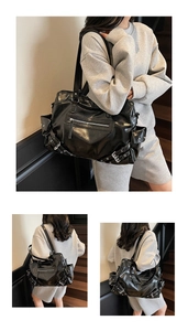 Detail of glossy black motorcycle tote with rivets, pleated finish and side pocket