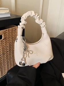Chic beige half-moon bag with ruched cloud handle and delicate white floral embroidery