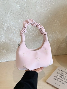 Pink cloud-shaped handbag with white flower embroidery and a scrunchie handle