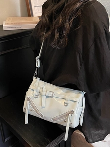 Minimalist mint green patent leather underarm bag with silver buckle and crossbody strap