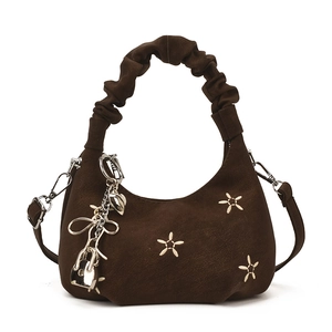 Dark brown star embroidered dumpling bag with scrunchie handle and retro charms