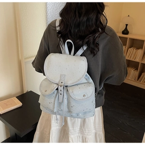 Light blue star pattern backpack with drawstring closure and silver buckle detail