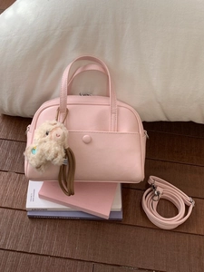 Pink Boston handbag for women with plush alpaca charm and adjustable shoulder strap