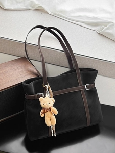 Retro black tote bag with brown straps and cute teddy bear pendant for women commuting