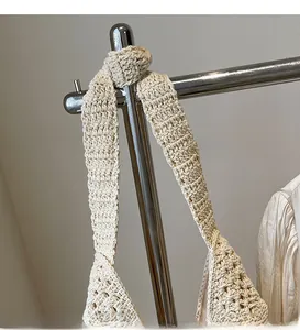 Detailed close-up of bohemian crochet tote bag showing thick beige cotton rope weaving
