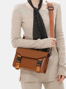 Brown canvas messenger bag with large capacity and buckle straps for men and women